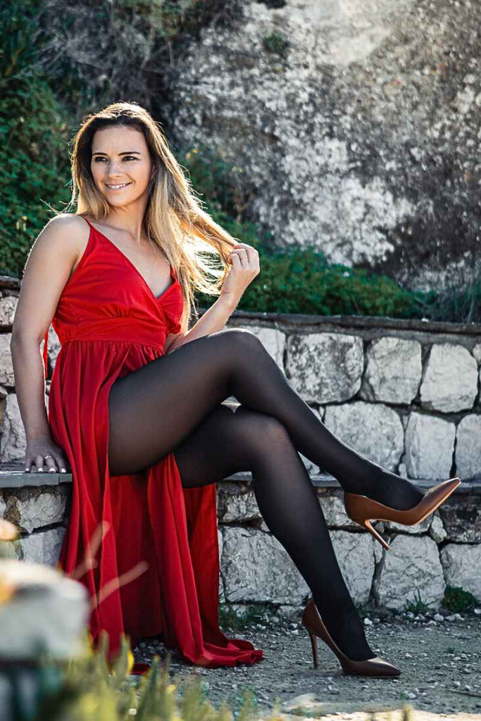 Red flowy dress with black opaque tights outfit