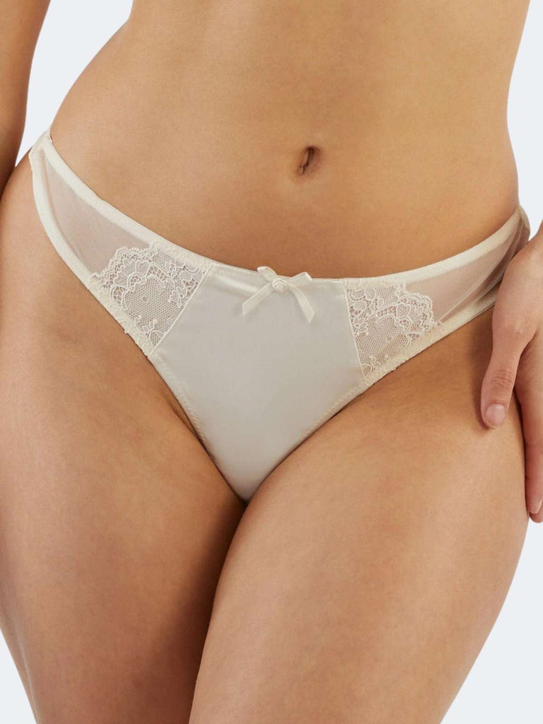 model wearing white floral lace panties with one satin bow