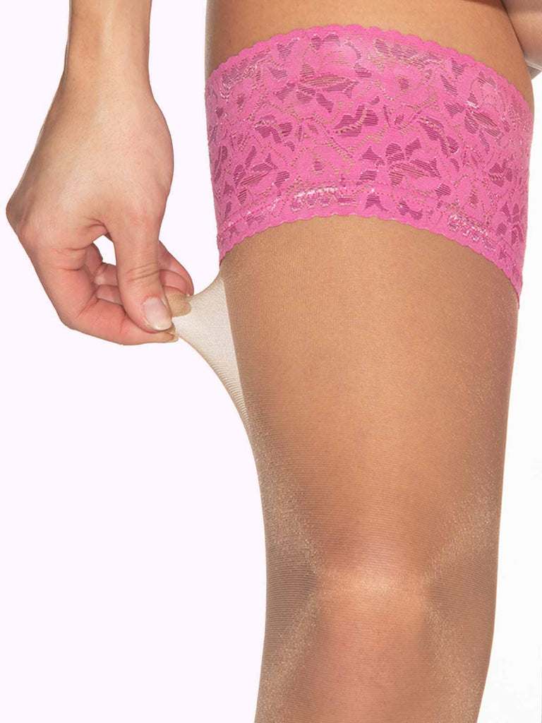 model wearing thigh high stockings made with silicone strip with pink lace top band close up